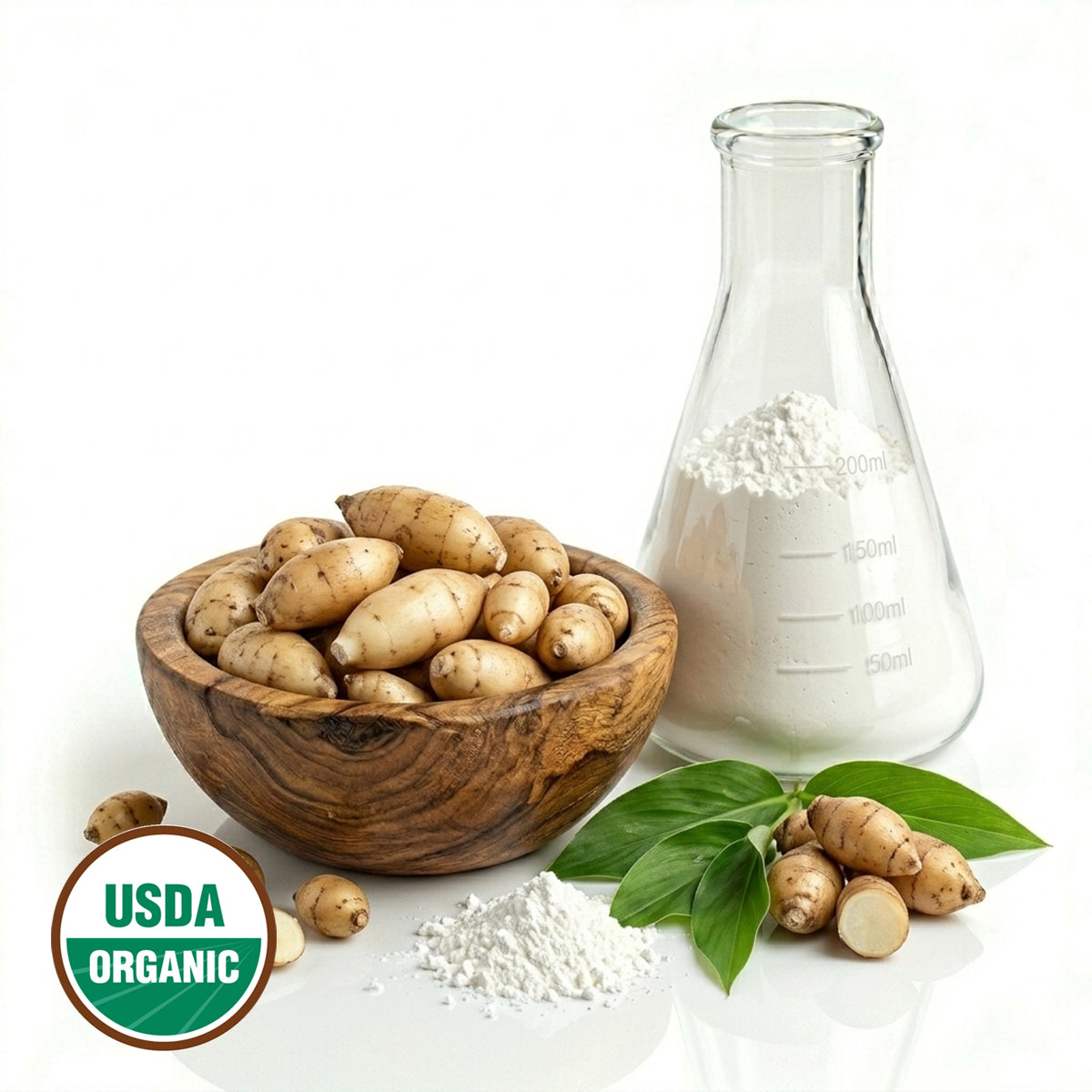 Wooden bowl with Arrowrooot, a glass flask with white powder, and green leaves on a white background with the USDA Organic logo.