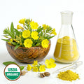 Evening primrose flowers in a wooden bowl next to a beaker with yellow powder, USDA Organic label.