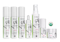 A set of white NIKO skin care products on a white background, including bottles, a dropper bottle, a pump bottle, and a jar, with a green USDA Organic seal.