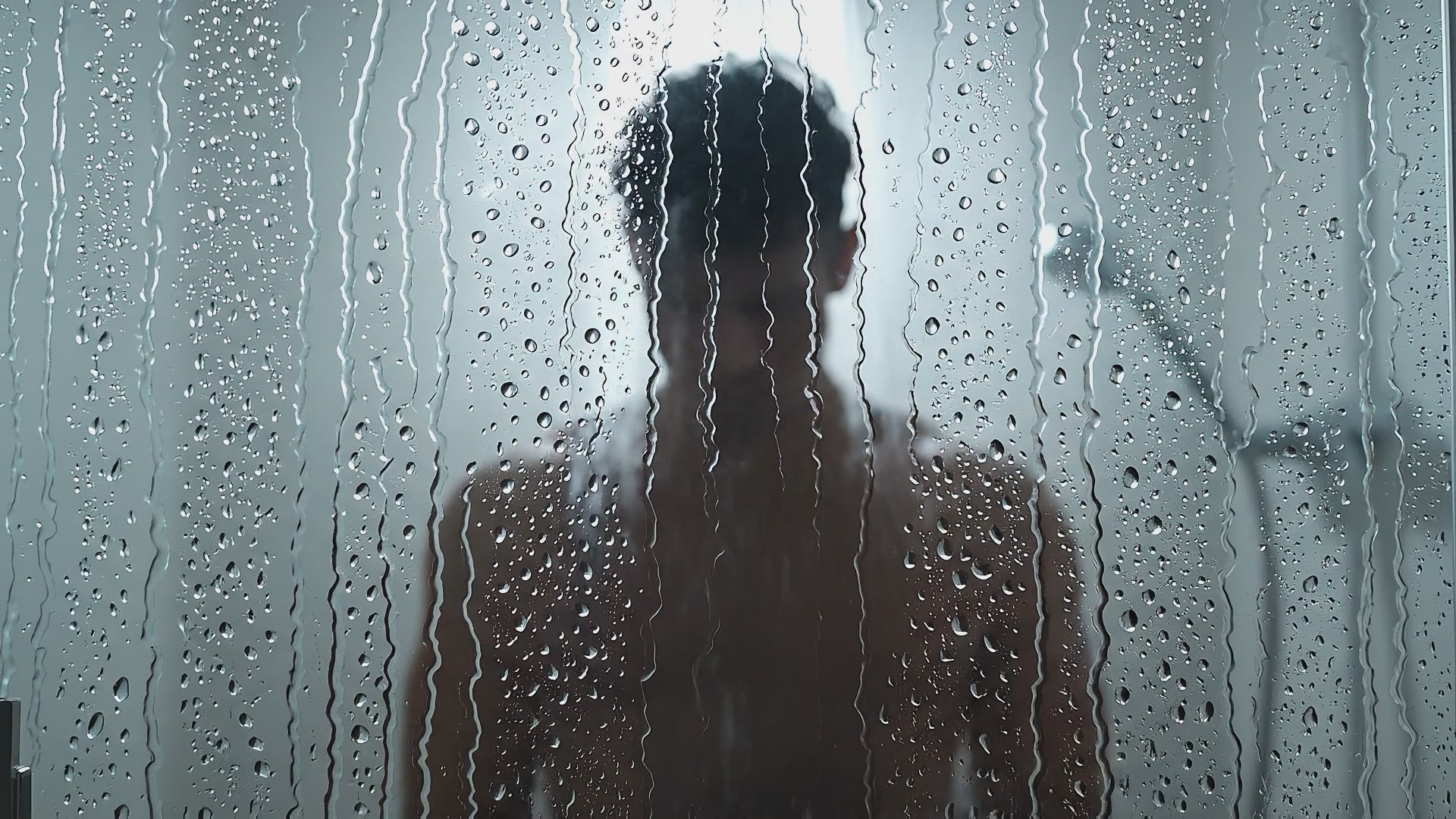 Model silhouette in shower